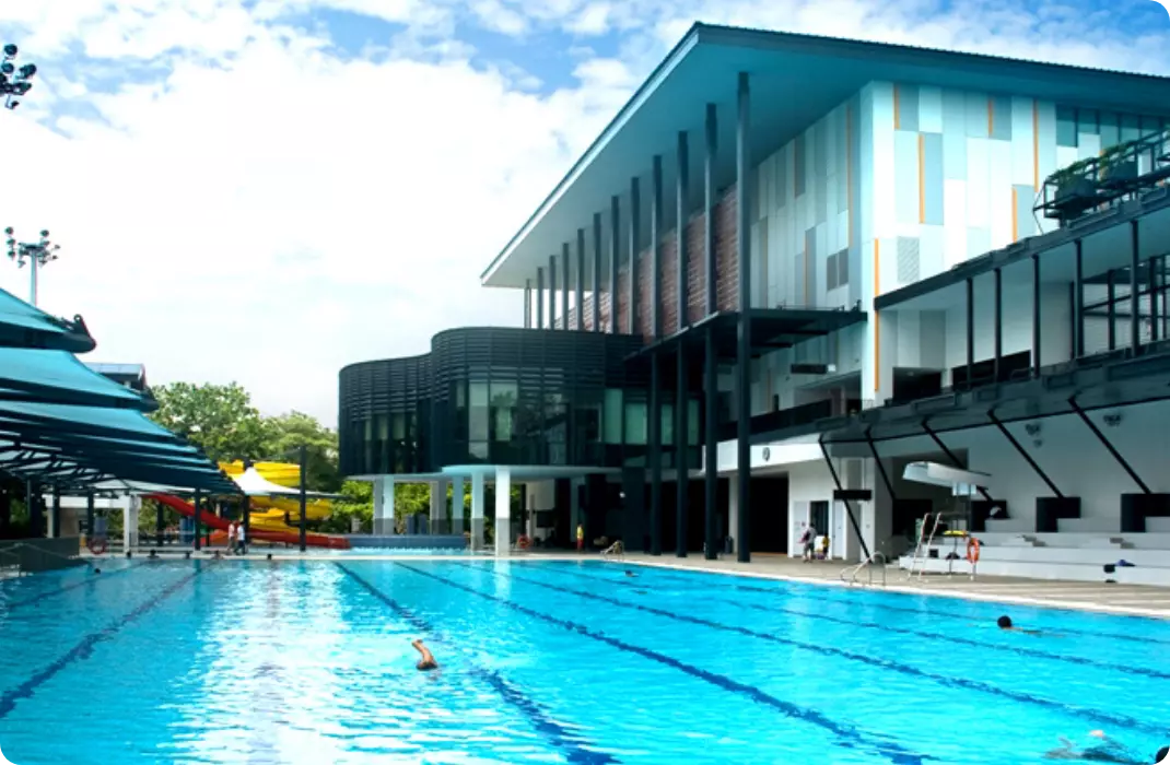 Pasir Ris ActiveSg Public Swimming Complex with shelter, swimming lanes, sports building, slides and deep pool